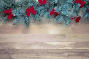 Christmas decoration on a vintage wooden background with red bows