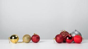 Christmas composition. Christmas balls with red on white background.