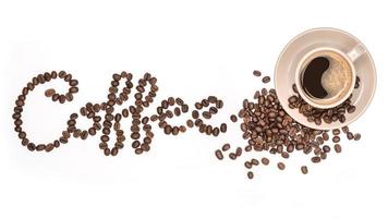 Coffee cup and Coffee beans spread with Font the word made of coffee beans isolated On a white background photo