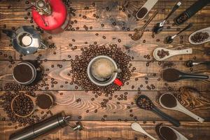 background concept Coffee cup and coffee grinder with other accessories. coffee beans photo