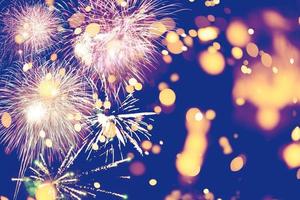 Fireworks at New Year and copy space abstract holiday background. Brightly Colorful Fireworks on twilight background with free space for text. New Year photo