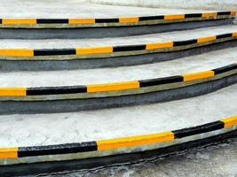 Yellow and black stripes, safety symbols at the edge of the stairs photo