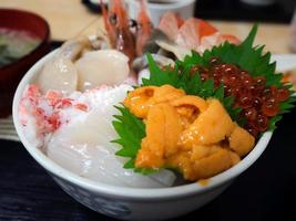 fresh seafood topped on rice bowl in Japanee style