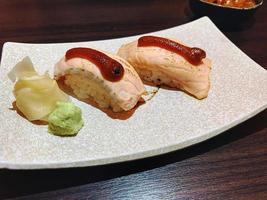 rice top with burnt salmon with sweet sauce, Japanese food, salmon aburi with saikyo sauce