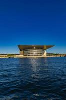 COPENHAGEN, DENMARK, JUNE 13, 2018 - View at Copenhagen Opera House in Denmark. This neofuturistic building was opened in 2005 and now is among the most modern opera houses in the world. photo