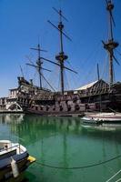 GENOA, ITALY, JUNE 2, 2015 - Il Galeone Neptune pirate ship in Genoa, Italy. The ship was constructed for Roman Polanski 1986 film entitled Pirates. photo