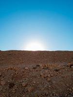 the sun behind the sands photo