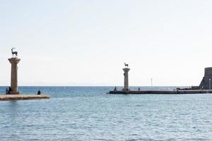 Deer statues welcoming to Rhodes harbor, Rhodes Town, Greece photo