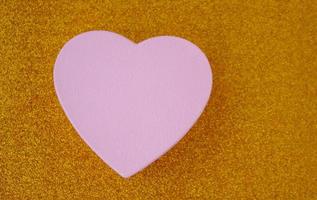 Christmas hearts on glittering gold background photo