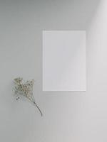 Greeting card mockup, blank invitation card template. Flat lay, Minimalist style photo