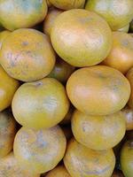 Close up portrait, texture of ripe orange for background necessity, selective focus photo