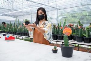 The hobby of a woman who likes to grow cactus in the greenhouse