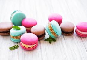 Colorful macaroons on a table photo