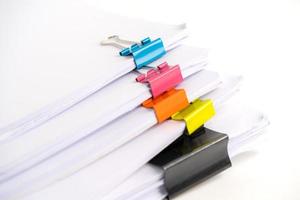 Stack of report paper files in business office clips. photo