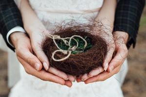 walk of the bride and groom through the autumn forest photo