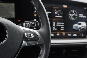 Interior of a prestigious modern black car. Leather comfortable seats and accessories and steering wheel photo