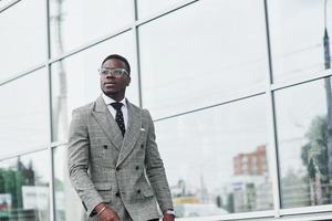 A nice African American businessman goes to the office photo