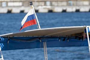 The Russian flag on the yacht in close-up photo