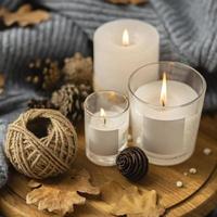 high angle lit candles with string pine cones. High quality beautiful photo concept