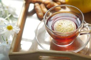 Top view of ginger tea on wooden background. photo