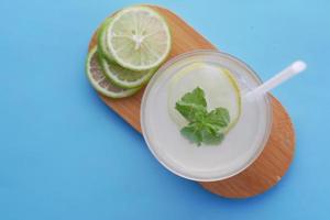 top view of fresh lime juice on table photo