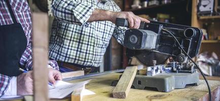 Unrecognizable senior couple in a carpentry photo