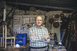 Carpenter in his workshop photo