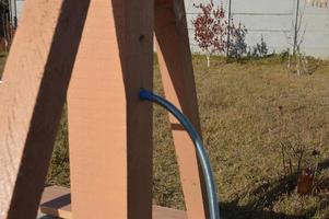 Wooden house for drinking water well photo