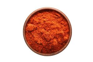 chili powder spice in wooden bowl