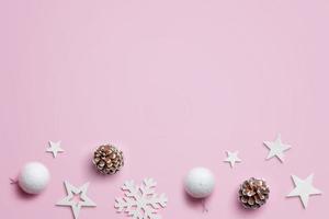 Christmas decoration on pastel pink surface. Top view, flat lay composition with copy space. Christmas background photo