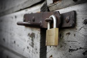 New lock and old wooden door photo