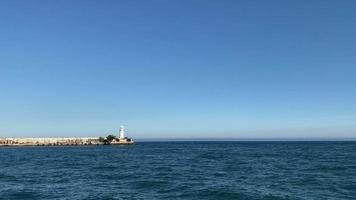 Seascape with a view of the white lighthouse. Yalta, Crimea. video