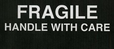 fragile handle with care sign photo