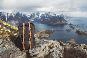 Hipster hiker tourist backpack on rock in mountain, panoramic landscape, traveler relax holiday concept photo