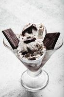 Speciality Italian stracciatella ice cream scoop with flakes of dark chocolate in a creamy vanilla ice-cream. Top view. Speciality Italian stracciatella ice photo