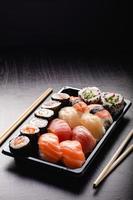 Sushi to go concept. Takeaway box with sushi photo