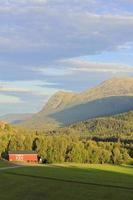 Norwegian, red farmhouse, countryside in Hemsedal, Buskerud, Norway. photo
