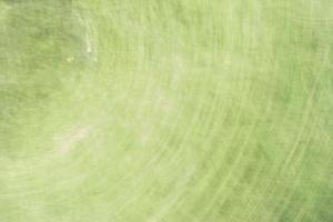 Fondo verde pálido abstracto con reflejos circulares.