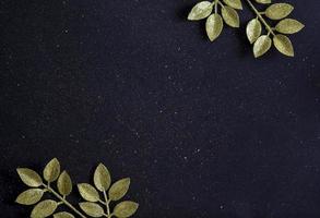 Flat lay Christmas floral with New Year tree branches and glitter on black background