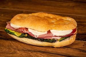 stuffed focaccia with cold cuts and vegetables photo