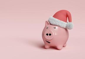 piggy bank with santa claus hat photo