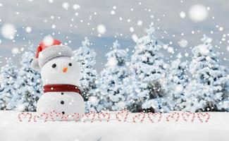 muñeco de nieve con bastones de caramelo en un paisaje nevado