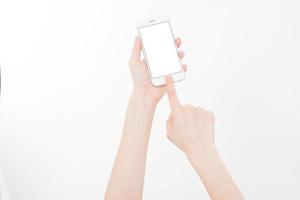 Hand holding white phone isolated on white clipping path inside. Top view.Mock up.Copy space.Template.Blank. photo