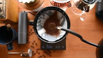 The barista is brewing coffee with traditional drip brewing equipment. video