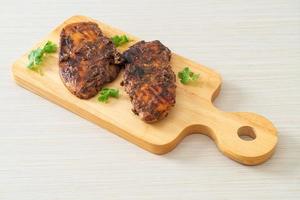 spicy grilled jamaican jerk chicken photo