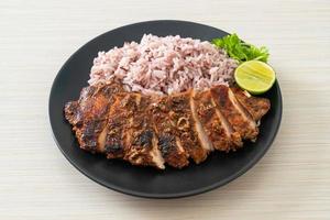 spicy grilled Jamaican jerk chicken with rice photo