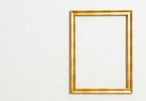 empty picture frame on white wall background photo