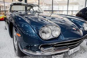 SINSHEIM, GERMANY - OCTOBER 16, 2018 Technik Museum. Blue vintage vehicle parked at the white rocks indoors photo