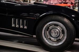 SINSHEIM, GERMANY - OCTOBER 16, 2018 Technik Museum. Beautiful vintage automobile. Big front wheel of sport car photo