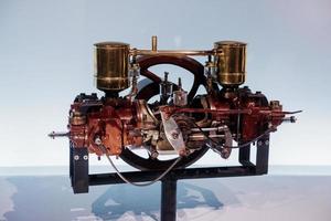 STUTTGART, GERMANY - OCTOBER 16, 2018 Mercedes Museum. Automobile engine stands on the stand on white background